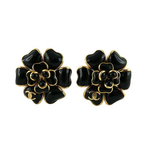 chanel black camellia earrings.